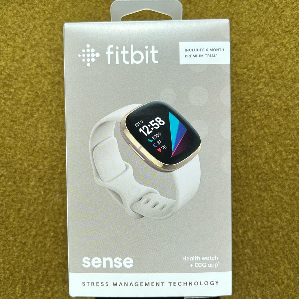 Fitbit Sense in lunar white/soft gold stainless steel